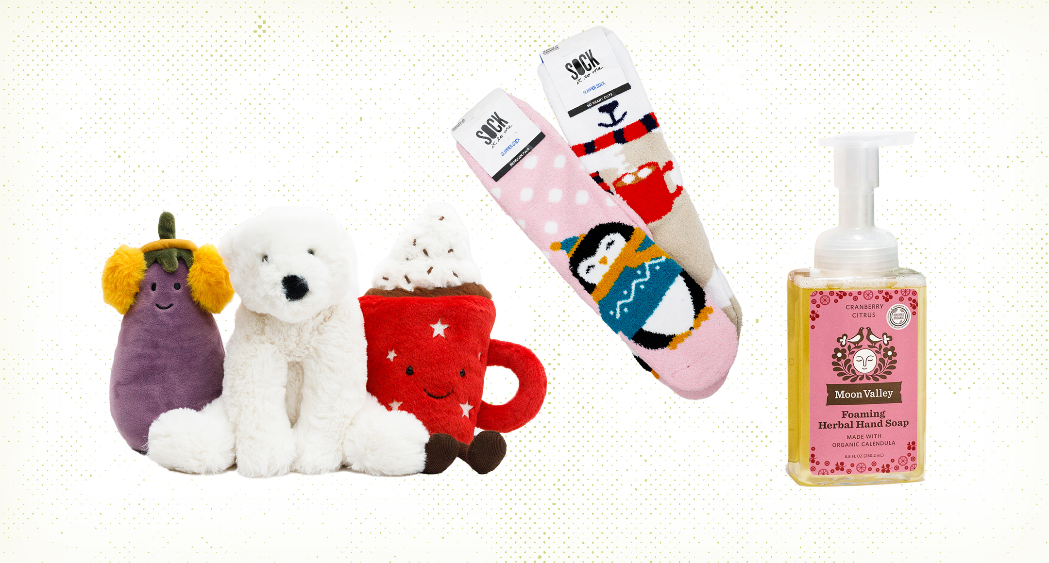 Stocking stuffers, including three plush stuffed toys, cozy socks with holiday designs, and scented liquid hand soap.