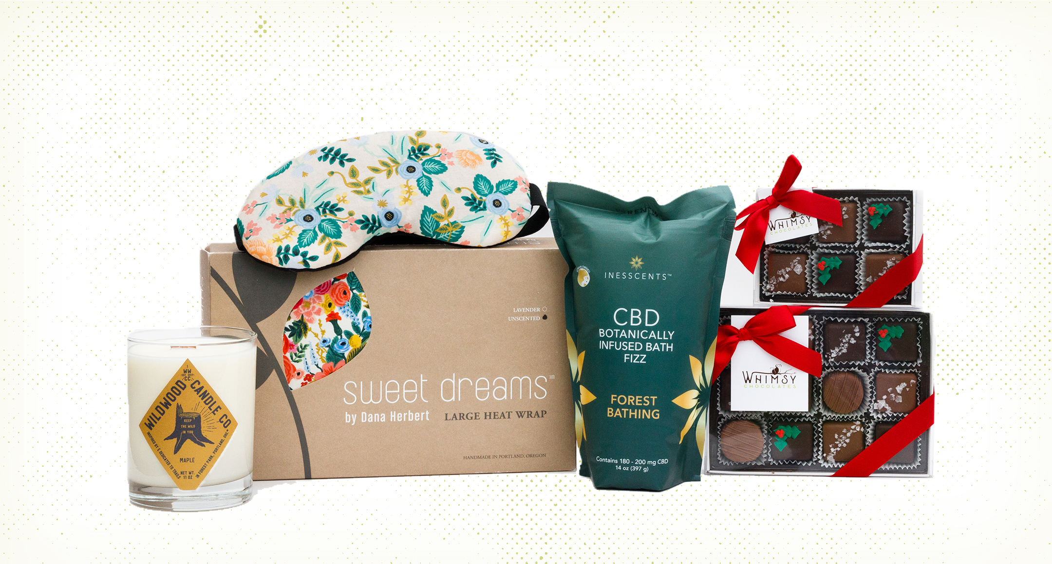 Gifts made for relaxing, including a sleep mask, CBD bath soak, chocolates, a candle, and a heat wrap. 