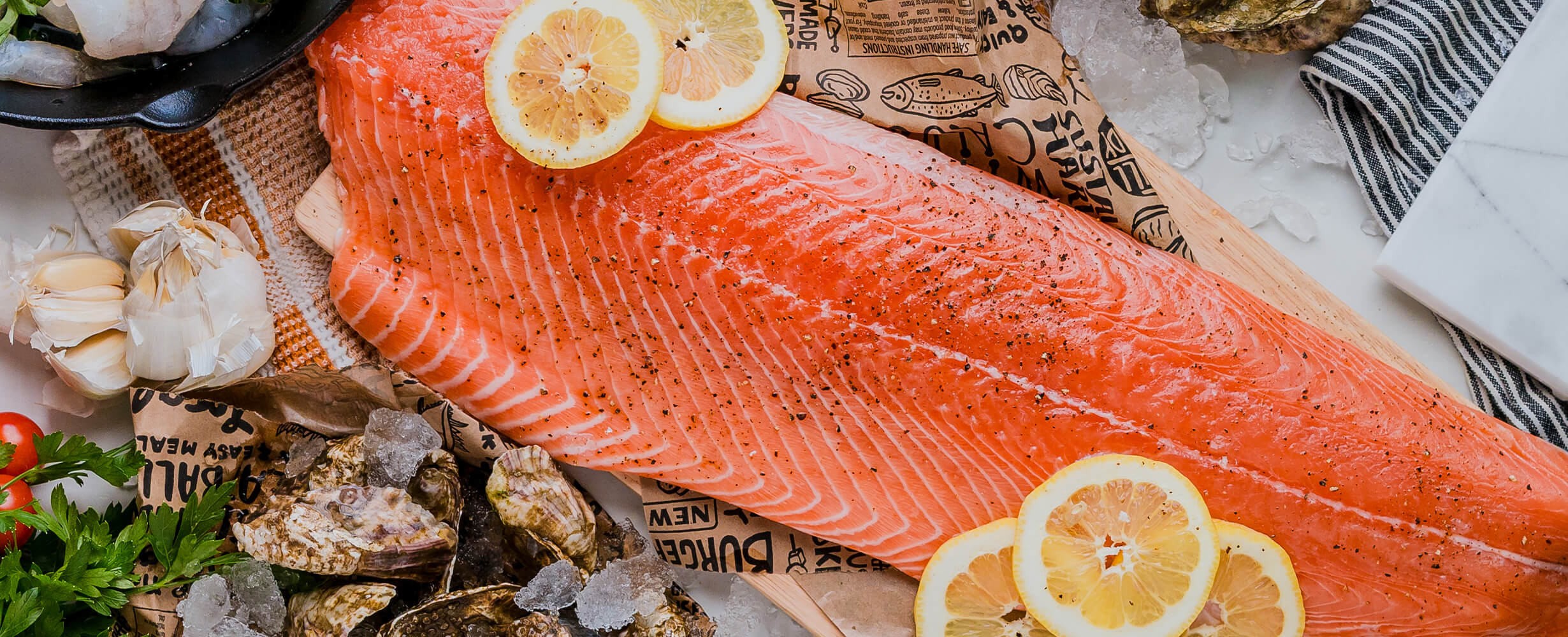 A cut piece of coho salmon with lemon slices