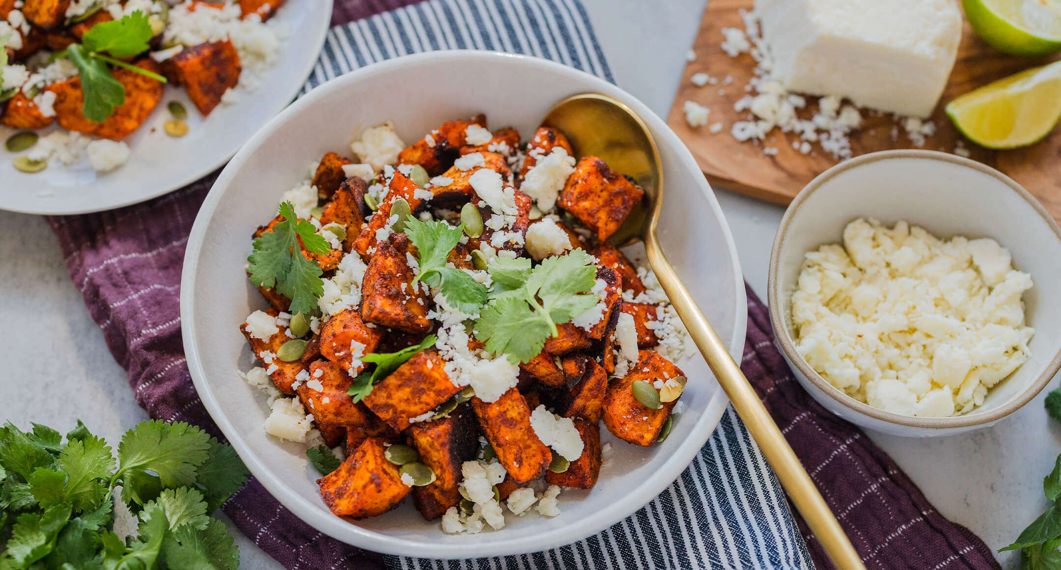 roasted sweet potatoes topped with crumbled cotija, pumpkin seeds and fresh cilantro