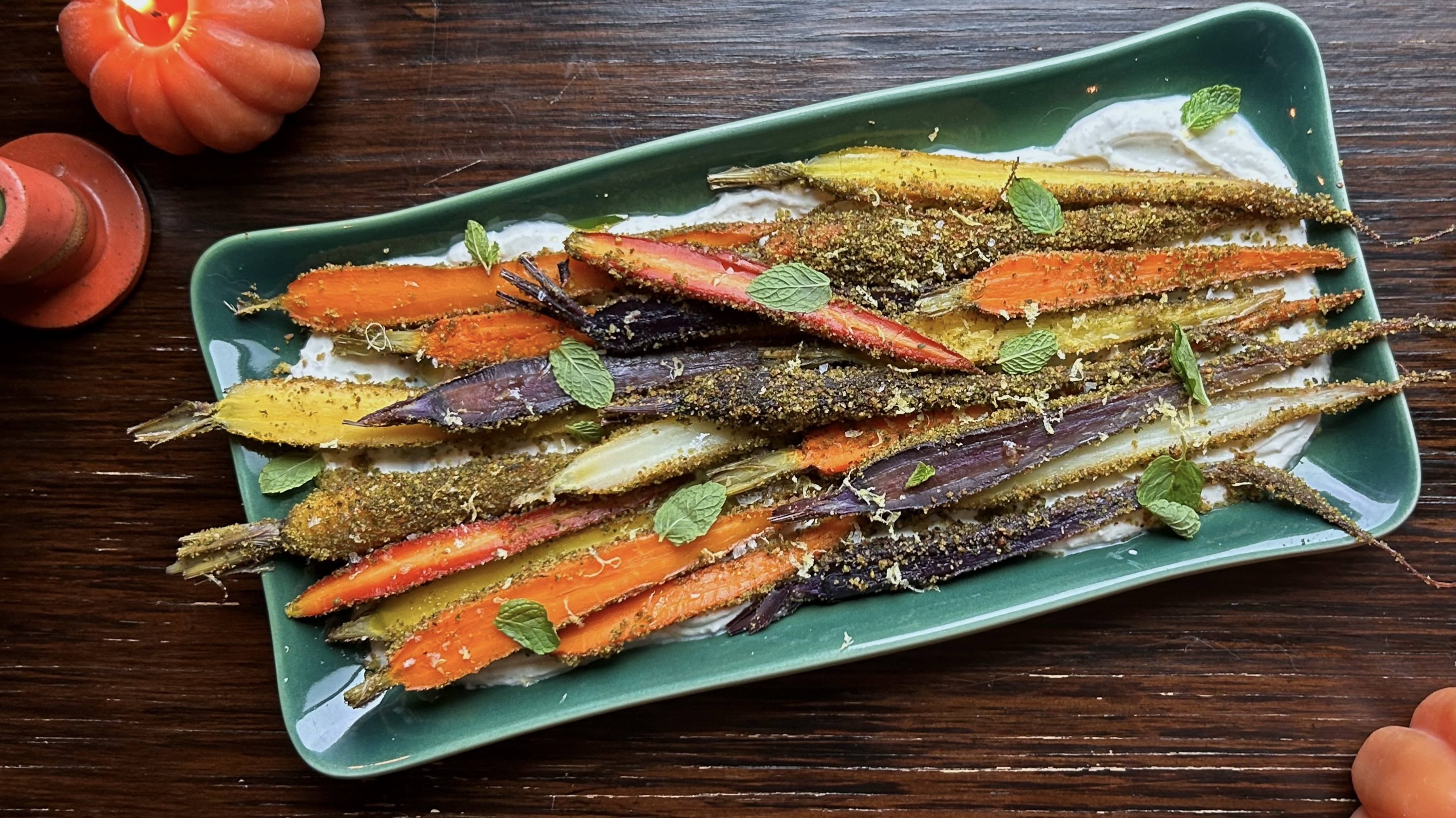 pistachio herb crusted carrots over spiced yogurt