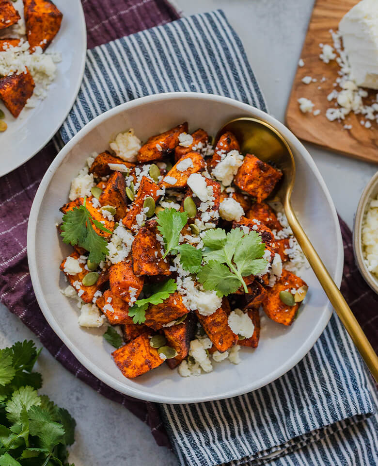 roasted sweet potatoes topped with crumbled cotija and fresh cilantro