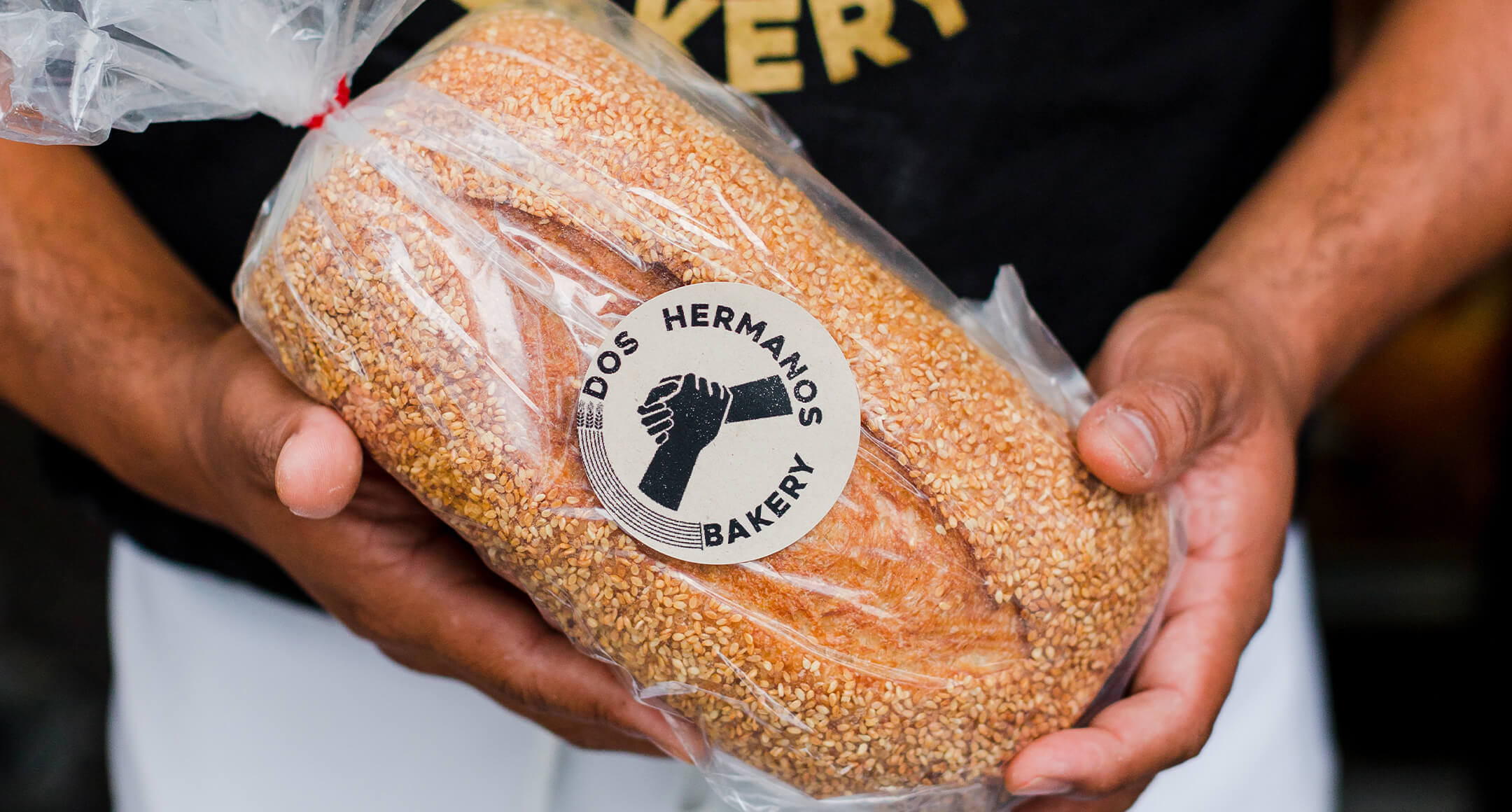 A packaged loaf of Dos Hermanos bread.