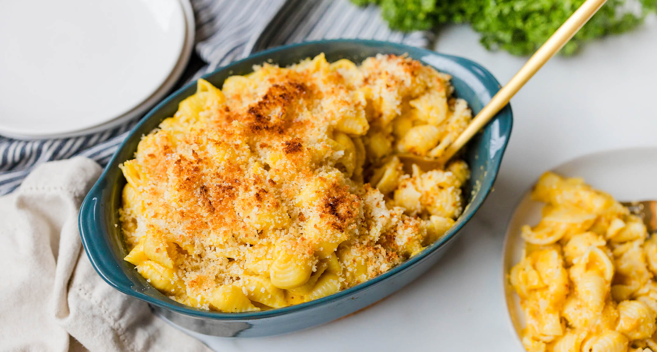 A pan of baked butternut squash mac & cheese.