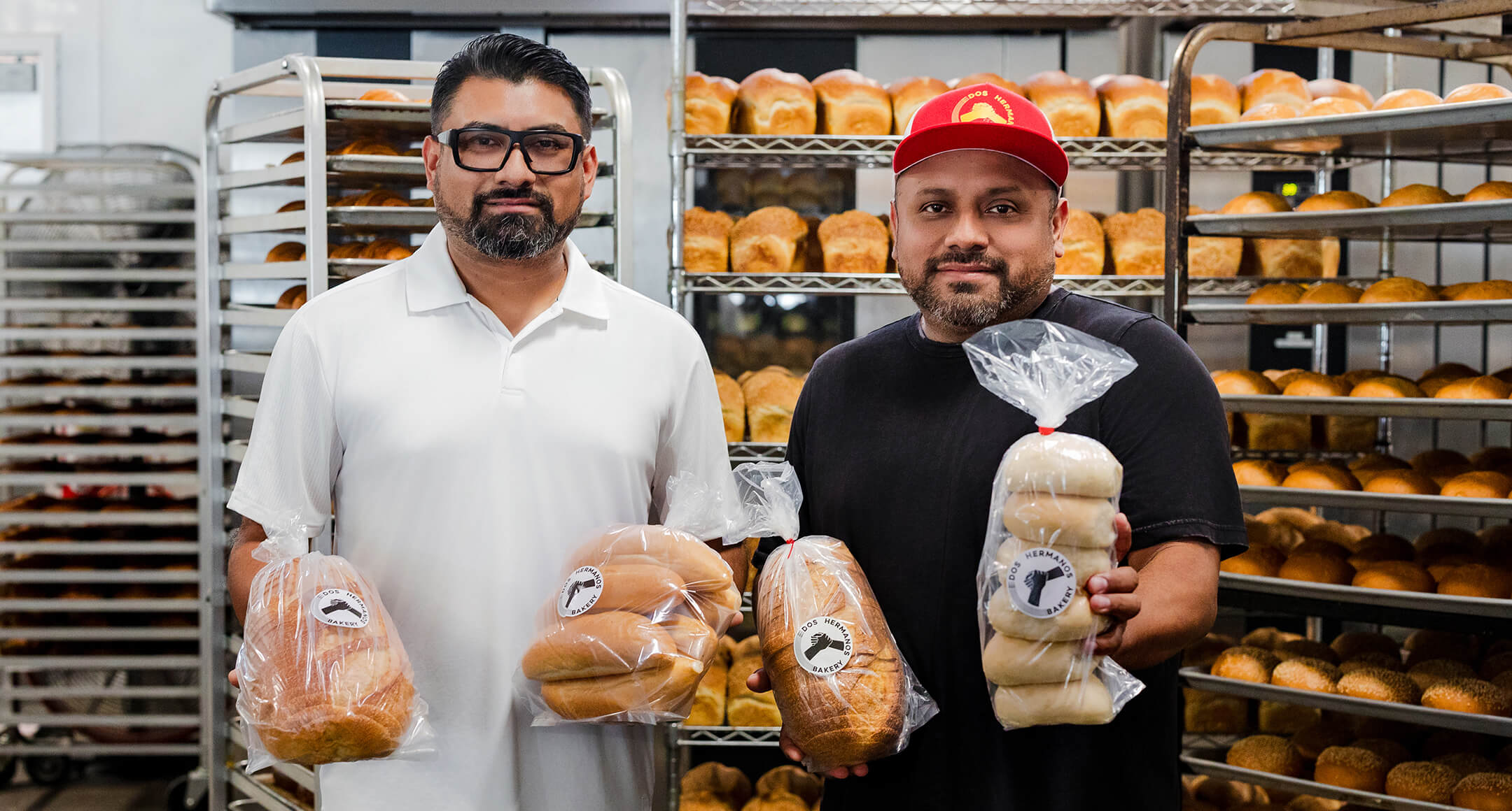 Gabirel and Josue holding some of their Dos Hermanos breads.