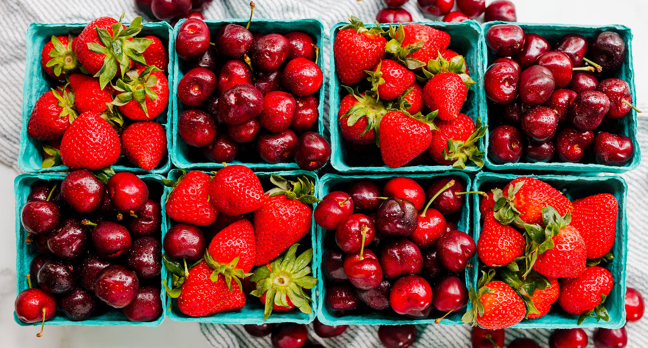 Pints of fresh, local strawberries and cherries