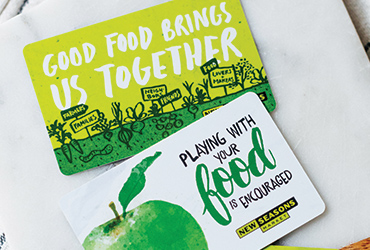 new seasons market gift cards on a countertop