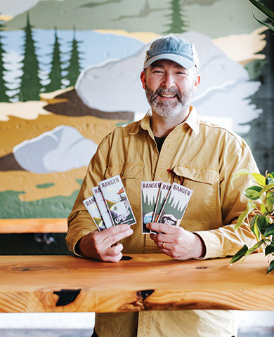 George Domurot of Ranger Chocolate holding chocolate bars