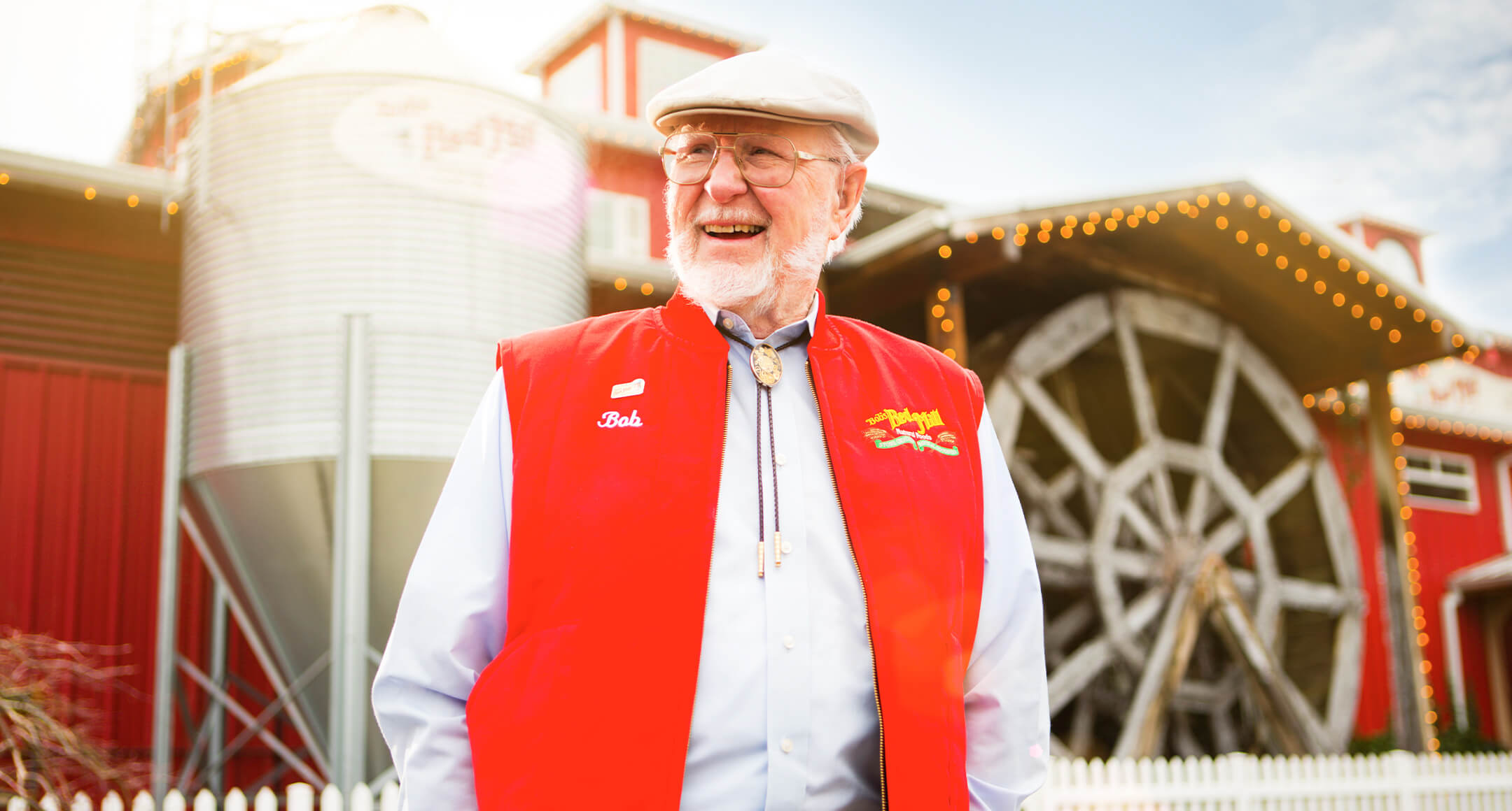 An image of Bob Moore of Bob's Red Mill Natural Foods wearing a red vest. 