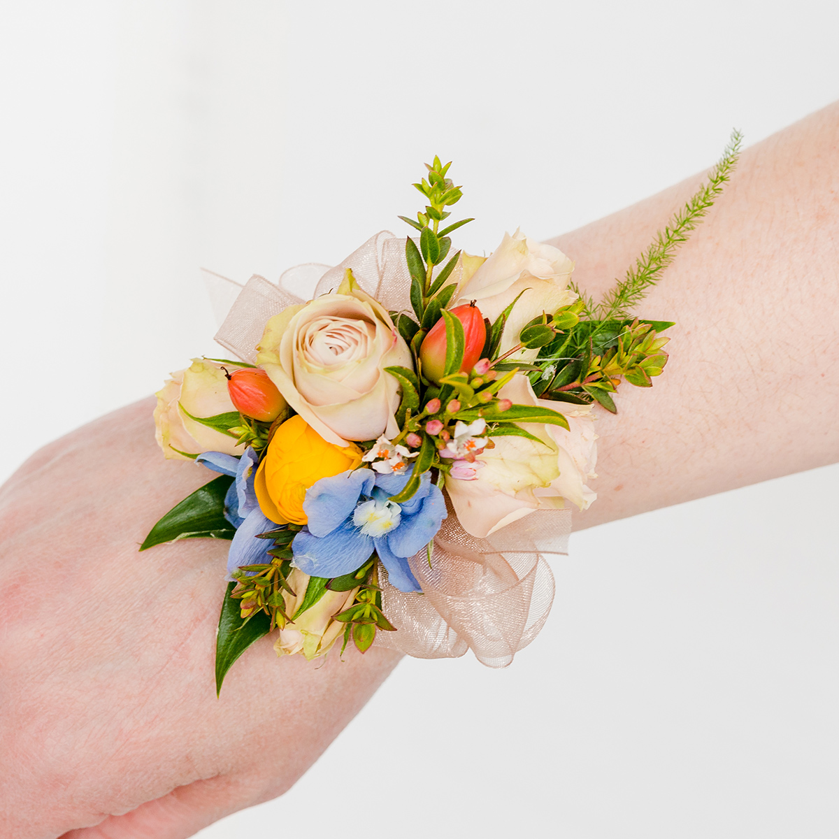 pink, orange, and blue wrist corsage