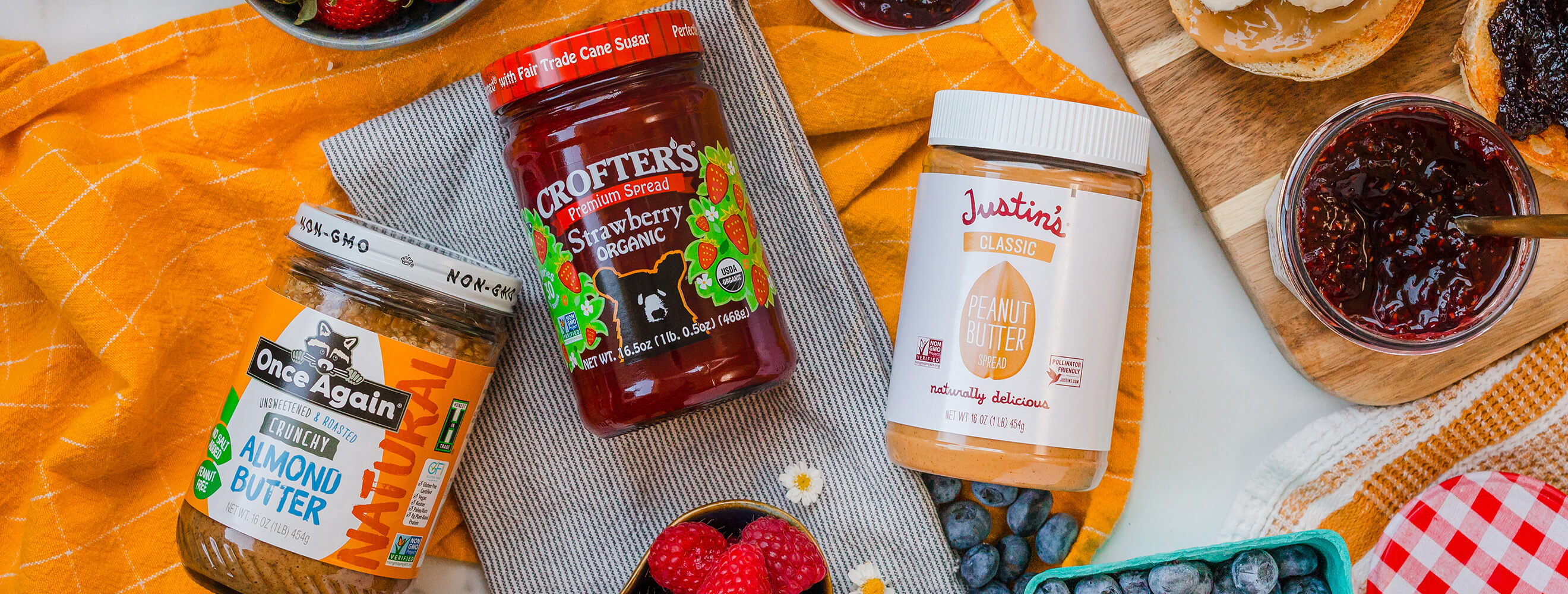 an overhead shot of various nut butter and jam advertising a sale.