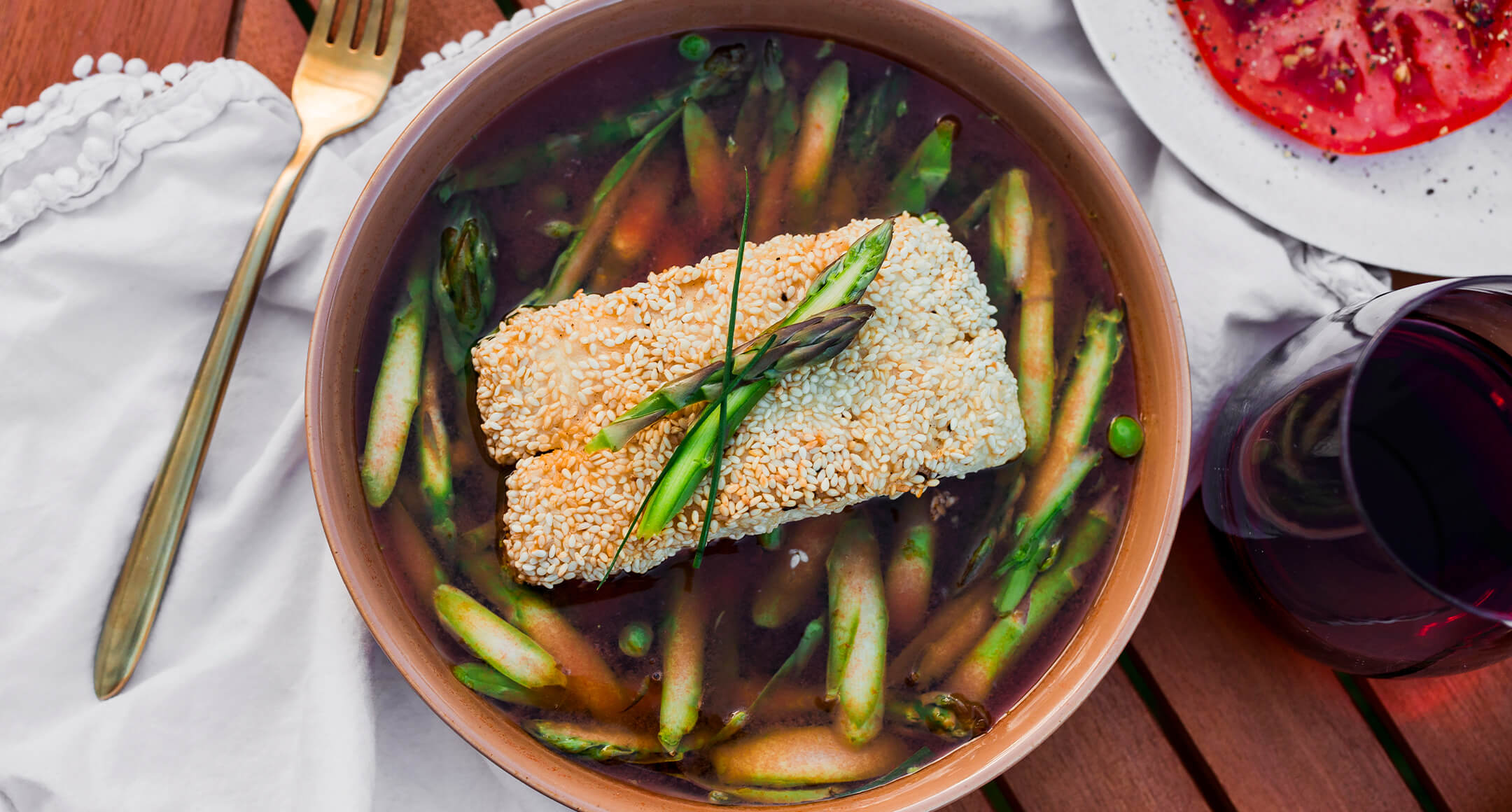 Sesame Crusted Halibut With Spring Vegetables & Tomato Broth