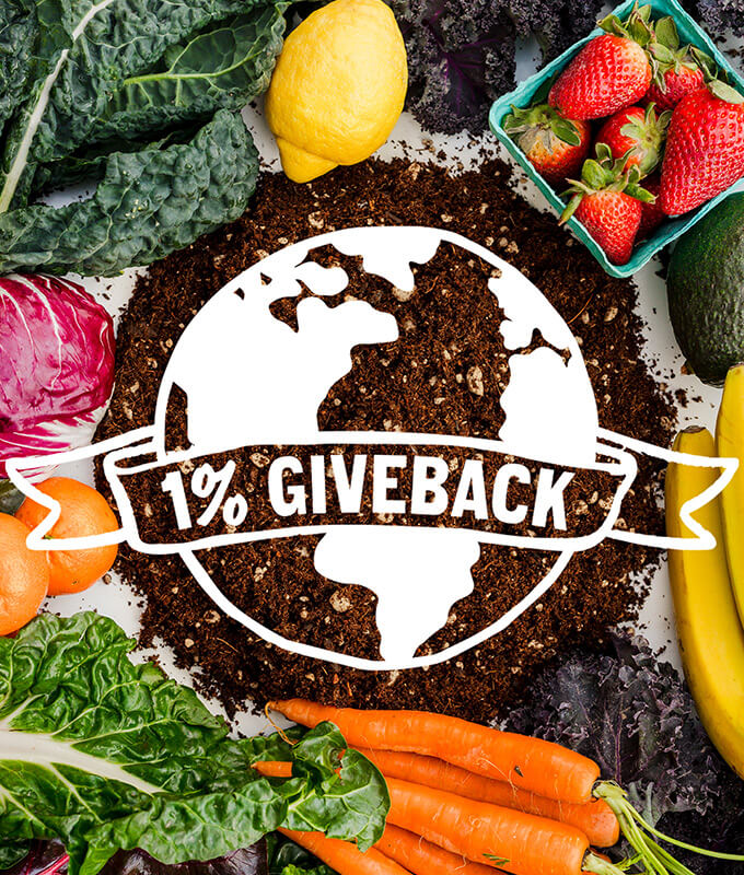 logo for 1% giveback over a photo of fresh fruits and vegetables.