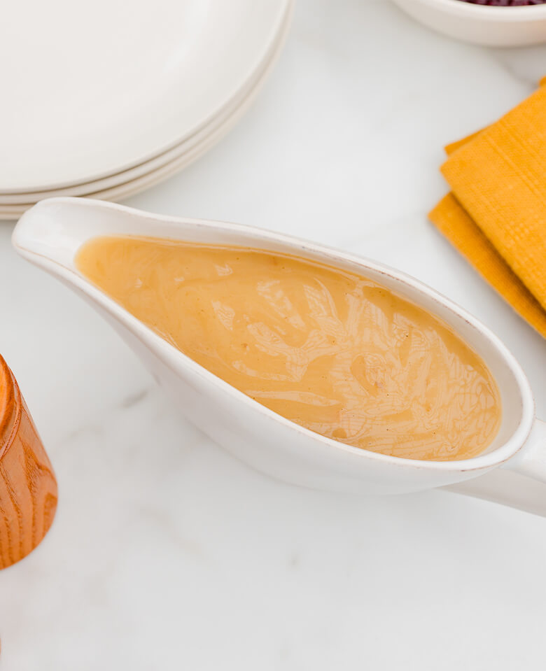 A gravy boat filled with turkey gravy