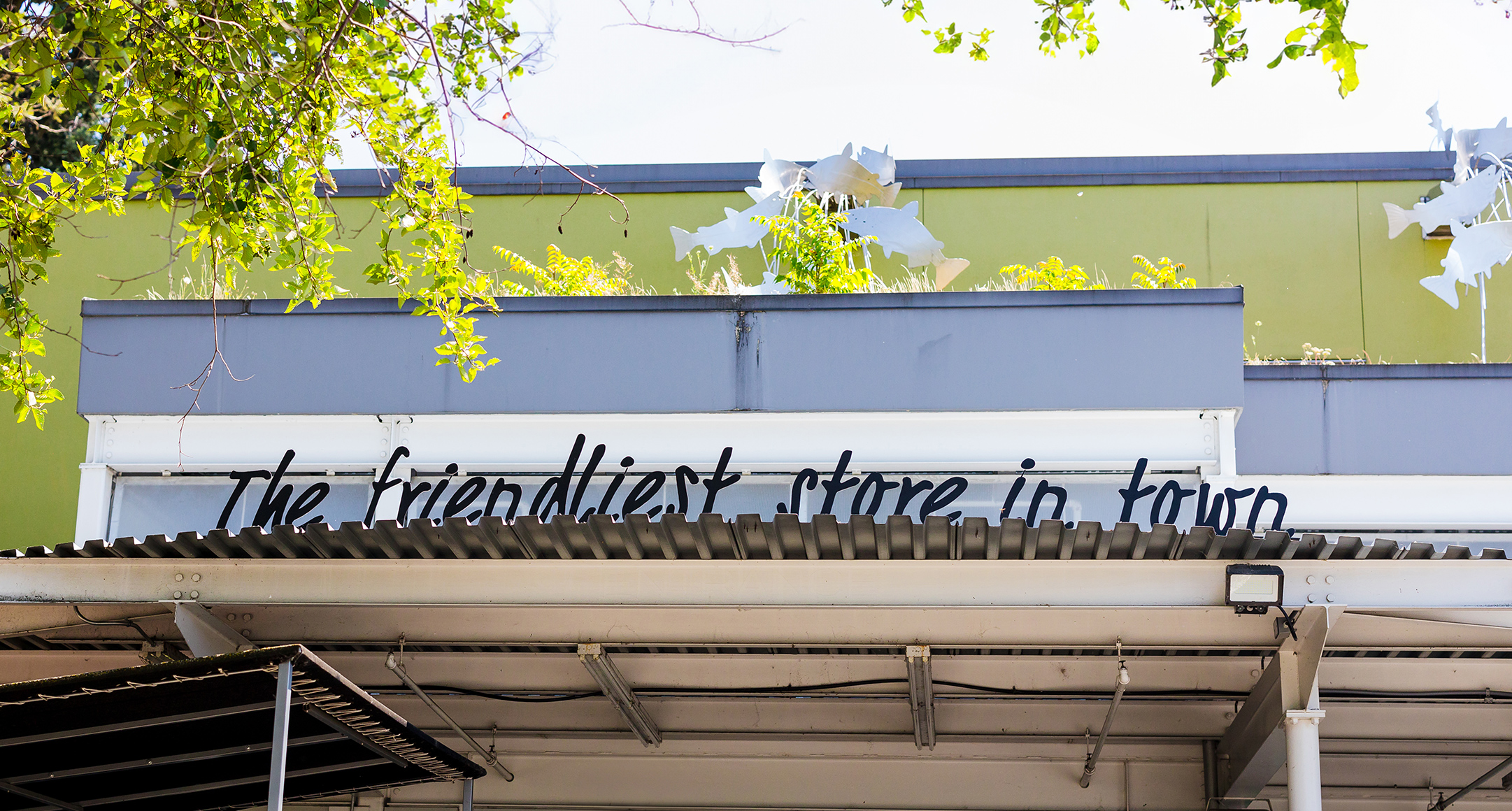 Friendliest Store in Town signage on top a store awning