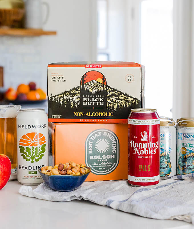 a picture of Non-alcoholic products displayed on a counter in cans and boxes