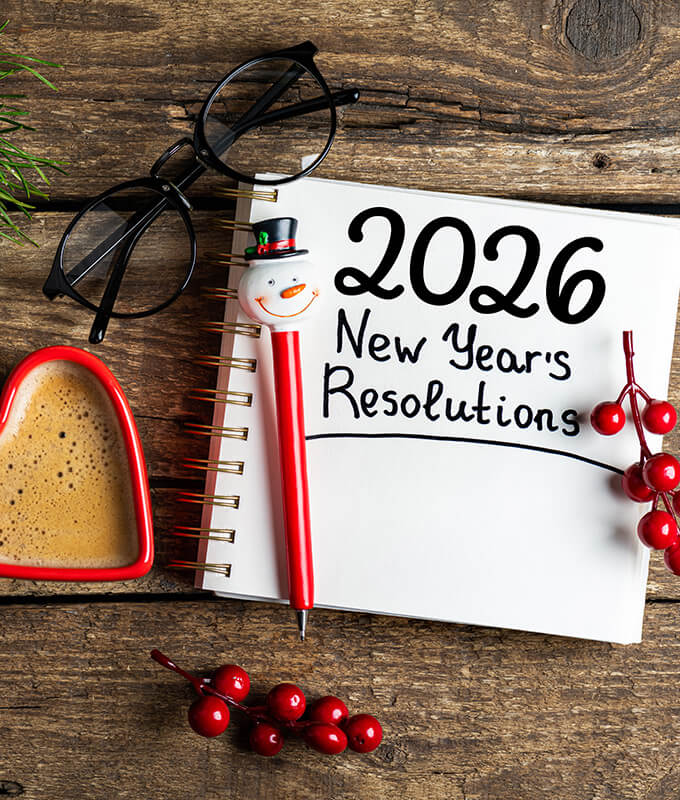 a pad of paper with the text written in pen "2026 New Year's Resolutions"