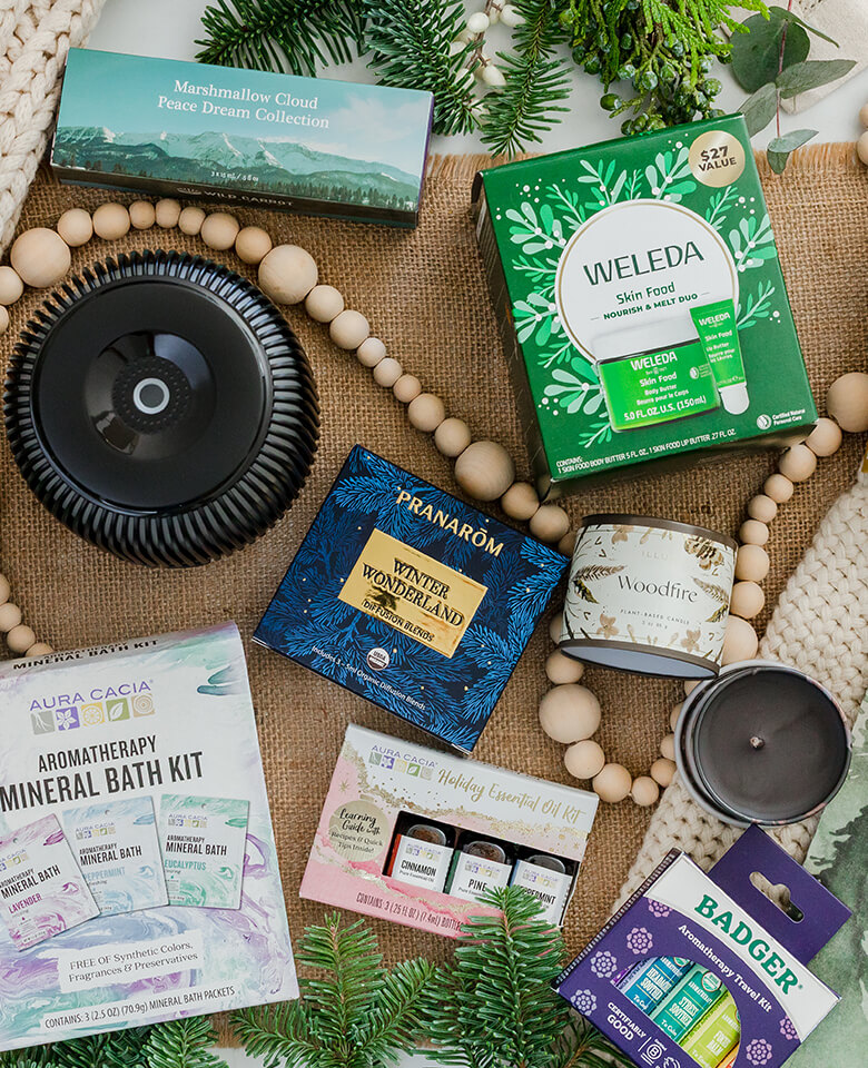 A collection of gifts including a candles, home scents and bath products.
