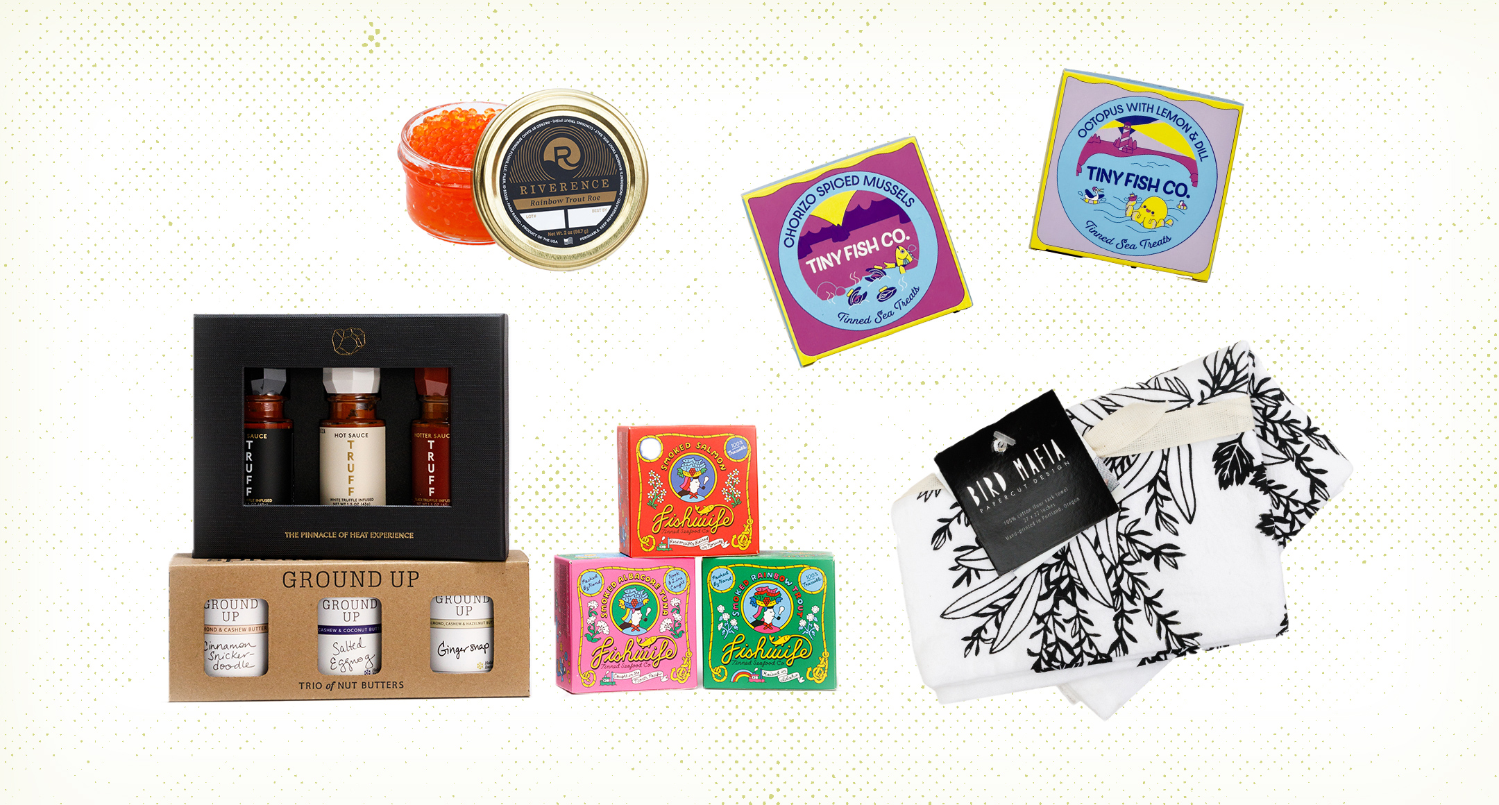 Food-related gifts, including caviar, tinned fish, a nut butter gift set, and a printed tea towel. 