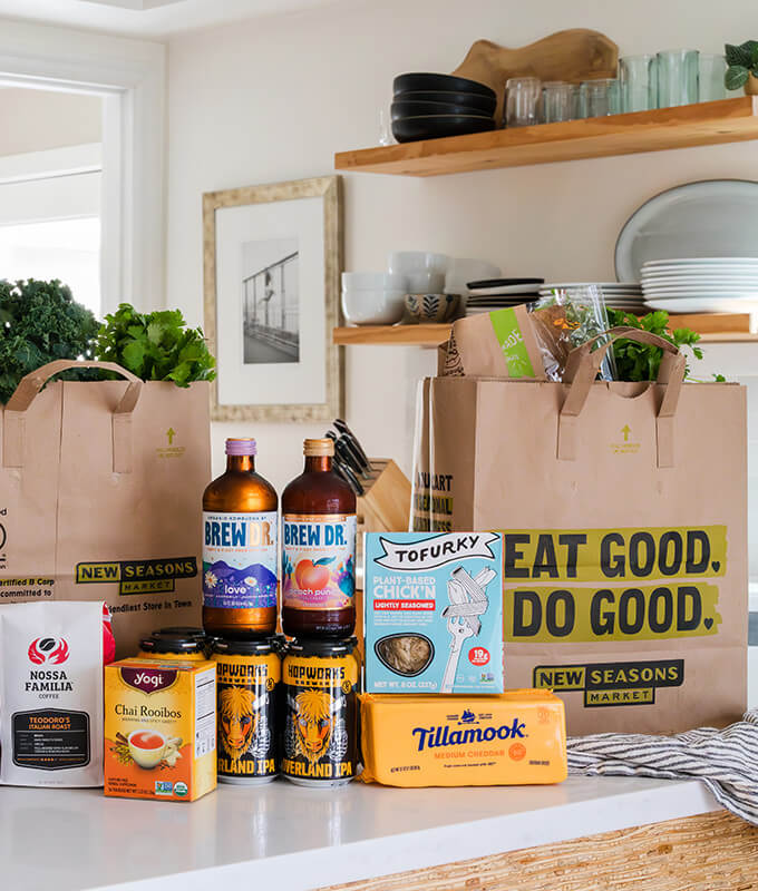 groceries on a kitchen counter that are all B Corps including Brew Doctor Kombucha, Yogi Tea, Tillamook Cheese and more.